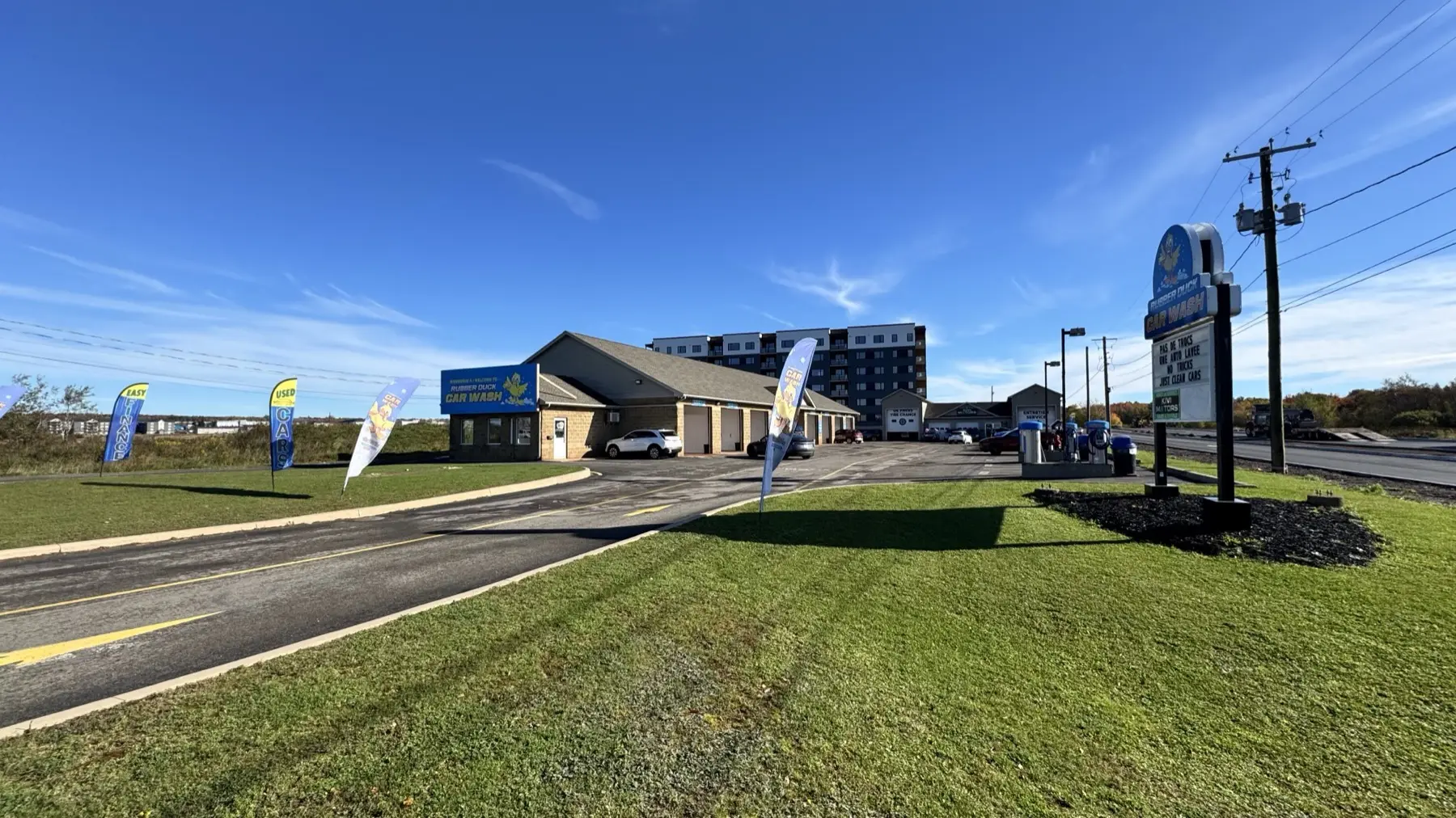 The Dieppe Rubber Duck Car Wash: the duck sign by the entrance and the row of wash bays